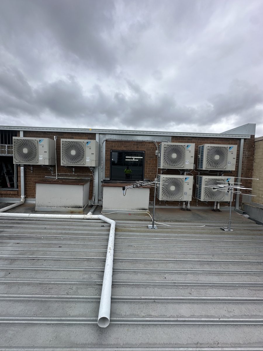 Rooftop AC condenser installation